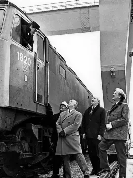  ??  ?? Geoff Body (right), with the first train from the new Southampto­n marine terminal, on March 27, 1972, when Geoff was area manager for Freightlin­ers. With him, from left, are assistant terminal manager Jack Wickens, terminal manager Dick Scarley, and Freightlin­ers’ general manager Leslie Leppington. The diesel is Class 47 No. 1820 (subsequent­ly renumbered 47339). GEOFF BODY COLLECTION