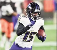  ?? David Richard / Associated Press ?? Baltimore Ravens wide receiver Marquise Brown runs after catching a pass, on the way to a 44-yard touchdown during the second half against the Cleveland Browns in December.