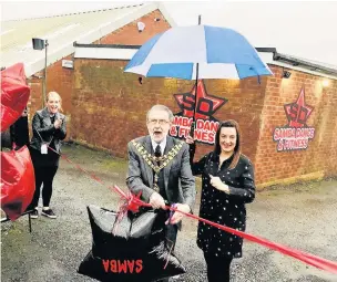  ??  ?? ●●The Mayor of Whitworth cuts the ribbon at Samba Dance and Fitness