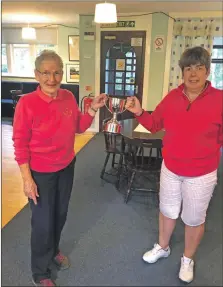  ?? ?? The winner of the Arran Ladies Golf Union Cir Mhor Trophy Susan Butchard, right, with retiring president Viv Parks.