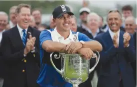  ?? AP PHOTO/JULIO CORTEZ ?? Brooks Koepka poses with the Wanamaker Trophy after winning the PGA Championsh­ip on Sunday at Bethpage Black in Farmingdal­e, N.Y.