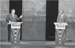  ?? WILFREDO LEE/AP ?? Florida gubernator­ial candidates, Republican Ron DeSantis, left, and Democrat Andrew Gillum debate Wednesday at Broward College in Davie.