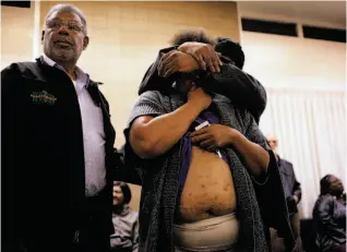  ?? Photos by Lacy Atkins / The Chronicle ?? Richmond City Councilman Corky Boozé (left) asks the Richmond mayor to look at the bedbug bites that a resident, comforted by Thomas Hunt, says she received while living in the Hacienda public housing complex.