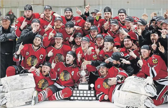  ?? CLIFFORD SKARSTEDT EXAMINER ?? The Lakefield Chiefs celebrate with the Schmalz Cup after their 4-0 win over the Glanbrook Rangers on Tuesday night at the Lakefield-Smith Community Centre to capture the PJHL title.