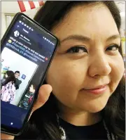  ?? RUDY GUTIERREZ/THE EL PASO TIMES VIA AP ?? In this Dec. 18, 2018, photo, Zelene Blancas, a first-grade bilingual teacher at Dr. Sue Shook Elementary School in El Paso, Texas, shows the Twitter video she posted of her students hugging one another after class that went viral. Blancas died of COVID-19 in December 2020.