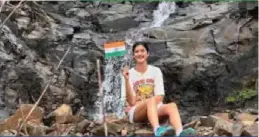  ?? ?? Shanaya Kapoor finds the perfect spot for a moment with her flag.