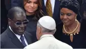  ??  ?? Unholy alliance: Pope Francis with Mugabe and his wife Grace at the Vatican in 2014