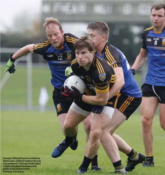  ??  ?? Fermoy’s Michael Pyne is tackled by Buttevant’s Tadhg O’Sullivan during last weekend’s Synergy Credit Union Junior A Football Championsh­ip game in Castletown­roche Photo by Eric Barry