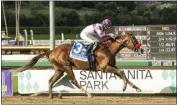  ?? BENOIT PHOTO VIA AP ?? Mario Gutierrez rides Slow Down Andy to victory in the Grade I Awesome Again Stakes at Santa Anita on Saturday.