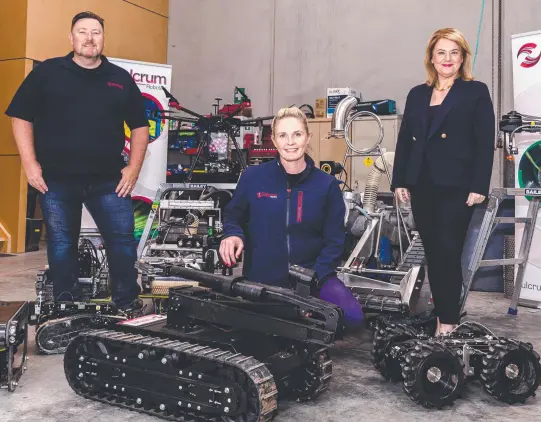  ?? Picture: Linda Higginson ?? Mike and Janelle Larkin, owners of Fulcrum Robotics, with Minister for Science and Technology Madeleine Ogilvie.