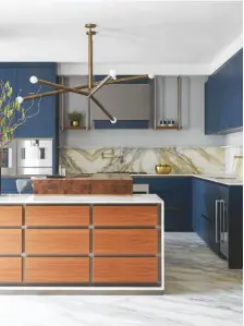  ??  ?? Bespoke kitchen featuring Golden Calacatta Borghini marble, from £90,000, Lanserring.
Interior design by Studio Vero