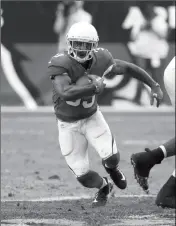  ?? ASSOCIATED PRESS ?? ARIZONA CARDINALS RUNNING BACK Kerwynn Williams (33) runs during the second half against the Tennessee Titans on Sunday in Glendale.