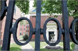  ?? MADDIE MEYER — GETTY IMAGES/TNS ?? A gate to Harvard Yard on the campus of Harvard University in Cambridge, Mass. The Supreme Court has agreed to review suits alleging racial admissions bias against Harvard and the University of North Carolina.