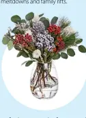  ??  ?? Silver festive cone: a mix of greenery with
red and silver accents, R149.99.