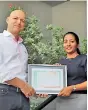  ??  ?? Go Vacation Sri Lanka General Manager Tim Grosse and Go Vacation Sri Lanka HR and Admin Manager and Travelife Sustainabi­lity Manager Ruvini Liyanaratn­e hold certificat­e issued by Travelife