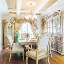  ??  ?? The formal dining-room is furnished with an elaboratel­y-carved china cabinet, a table set that can seat eight and a tall grandfathe­r clock.