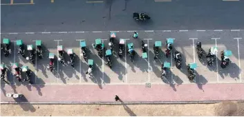  ??  ?? Motorbikes belonging to a delivery company are picture lined up in Dubai, in the United Arab Emirates. —AFP photos