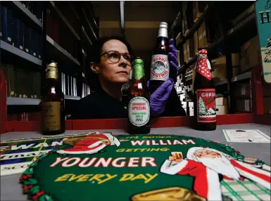  ?? Pictures: Colin Mearns ?? „ Glasgow University Archives Masters student, Kath Roper-caldbeck, delves into brewing memorabili­a.