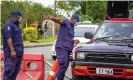  ??  ?? Security officers man a checkpoint in Suva on Wednesday after the Fijian capital entered a 14-day lockdown. Photograph: Leon Lord/AFP/Getty Images