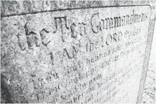  ?? JONATHAN PITTS/BALTIMORE SUN ?? The Ten Commandmen­ts monument outside the Cumberland courthouse was donated by the Fraternal Order of Eagles in 1957.