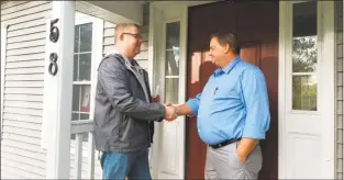  ?? Contribute­d photo ?? Sean Moriarty, candidate for first selectman in Haddam, greets residents Monday afternoon on the campaign trail.