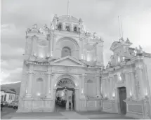  ??  ?? Iglesia de San Pedro, one of the oldest churches in Antigua, Guatemala, is lit up at night.