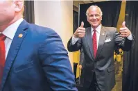  ?? JEFF BLAKE/THE STATE VIA AP ?? Following his victory in the primary runoff election, South Carolina Gov. Henry McMaster leaves his suite at Spirit Communicat­ions Park on Tuesday and heads to the podium speak at his victory party in Columbia, S.C.