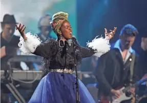  ??  ?? Lauryn Hill pays tribute to Nina Simone at her Rock and Roll Hall of Fame induction.