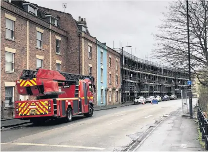  ?? Lee Goolden ?? Firefighte­rs at the scene in York Road yesterday after high winds during Storm Ciara