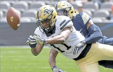  ?? Matt Freed/Post-Gazette ?? Pitt’s Dane Jackson breaks up a pass intended for Taysir Mack (11) in the team’s spring game in April at Heinz Field.