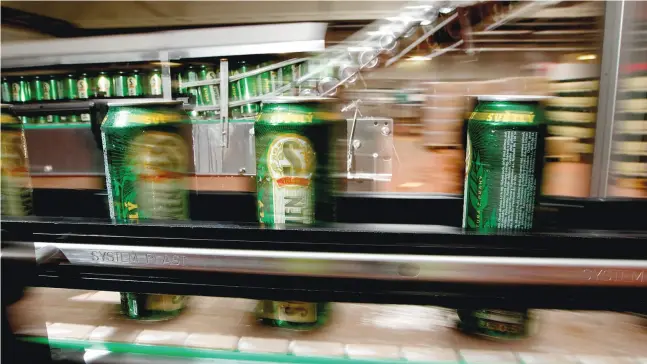  ?? COURTESY OF STARBEV ?? Cans of Staroprame­n beer move along a conveyor belt at a brewery in Prague. Starbev employs 4,100 people and produces 13.3 million hectolitre­s a year.