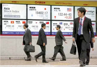  ??  ?? Many analysts expect the Bank of Japan’s bond-buying program to reach a limit with the bank already owning more than 42 percent of the market. (Reuters)