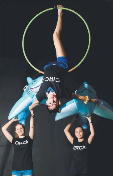  ?? Pictures: STEWART McLEAN; BRENDAN RADKE ?? THE UPSIDE: Cairns’ Maya Hassall, 15, Millie Scott, 14, and Madison Hull, 15, rehearse for the of the Animals after a week-long intensive workshop with Circa. Carnival