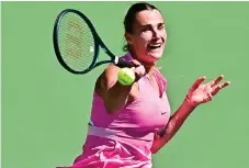  ?? — AFP file photo ?? Sabalenka hits a forehand return to USA’s Emma Navarro in their Round of 16 match at the ATP-WTA Indian Wells Masters at the Indian Wells Tennis Garden in Indian Wells, California.