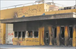  ?? Ahmad Al-Rubaye / AFP via Getty Images ?? The entrance leading to the U.S. Embassy in the capital Baghdad on Thursday, which was damaged the day before by Hashed supporters. The U.S. Embassy siege by proIran protesters in Baghdad lasted just over a day, but analysts warn it could have lasting implicatio­ns for Iraq's complex security sector and diplomatic ties.