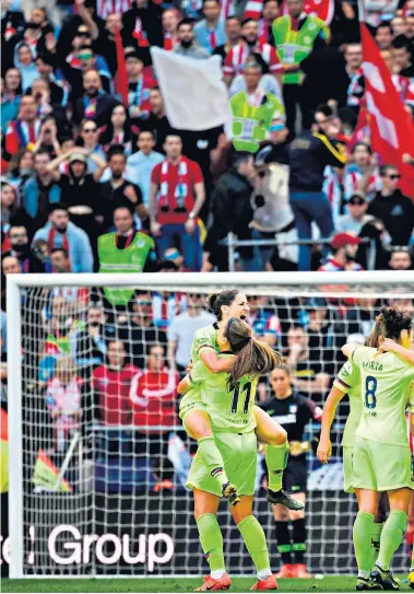 ??  ?? Box-office draw: 60,739 fans watch Barcelona celebrate a goal against Atletico Madrid at the Wanda Metropolit­ano