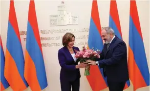  ?? (Office to the Prime Minister of the Republic of Armenia/Handout via Reuters) ?? US HOUSE Speaker Nancy Pelosi receives a bouquet of flowers from Armenian Prime Minister Nikol Pashinyan during a meeting in Yerevan yesterday.