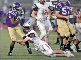  ?? Katharine Lotze/The Signal ?? Valencia’s Mykael Wright (2) tries to pull out of a tackle by Chaparral’s Anthony Mosharrafa against Chaparral of Scottsdale, Ariz. on Friday.