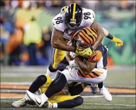  ?? ANDY LYONS PHOTOS / GETTY IMAGES ?? Steelers linebacker Vince Williams tackles Bengals RB Joe Mixon on Monday. Williams ranks second on the Steelers in both tackles and sacks.