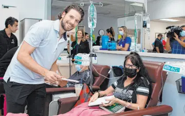  ?? ?? Comprehens­ive Cancer Centers
The Golden Knights’ Shea Theodore with Comprehens­ive Cancer Centers patient Kimberly Marushok. The defenseman and Comprehens­ive Cancer Centers launched Kay’s Power Play in the memory of his grandmothe­r, the late Kay Darlington.