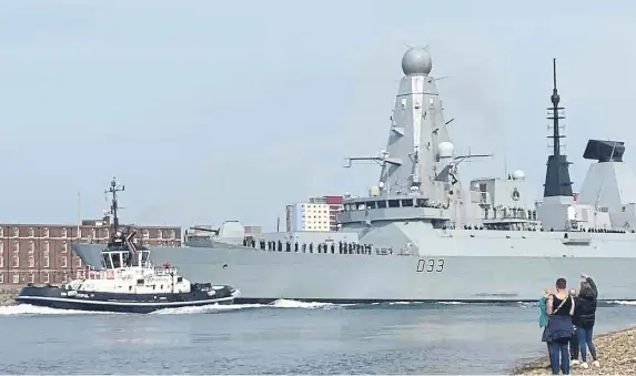  ?? ?? HMS Dauntless leaves Portsmouth as she heads for the Caribbean