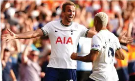  ?? Photograph: Mike Egerton/PA ?? Harry Kane beams at Richarliso­n after he provided the cross for Kane’s second goal.