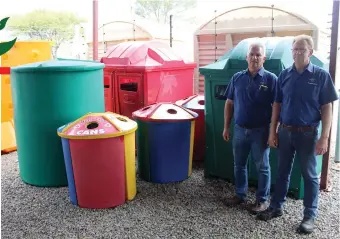  ?? ?? Regional sales manager André Maré and branch manager Christo Scheepers at a selection of the colourful merchandis­e available.