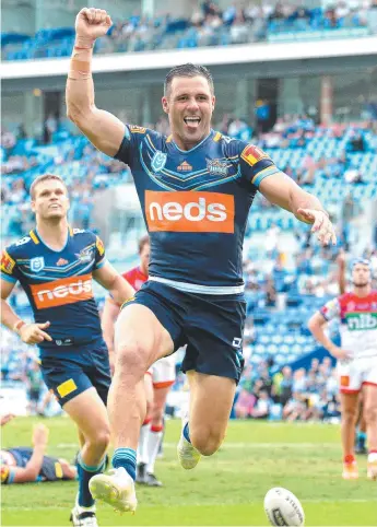  ?? Picture: GETTY IMAGES ?? The Titans’ Michael Gordon celebrates a try against Newcastle earlier this year.