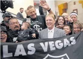  ??  ?? Raiders owner Mark Davis, centre, in Las Vegas last year.