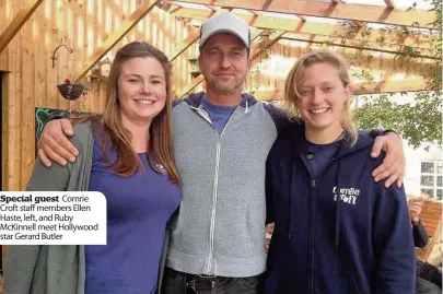  ??  ?? Special guest Comrie Croft staff members Ellen Haste, left, and Ruby McKinnell meet Hollywood star Gerard Butler