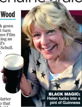  ?? ?? BLACK MAGIC: Helen tucks into a pint of Guinness