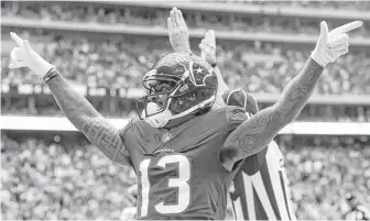  ?? Mark Mulligan / Houston Chronicle ?? Texans wide receiver Braxton Miller celebrates after scoring on a 1-yard touchdown reception — his first of the season — during the second quarter of Sunday’s game at NRG Stadium.