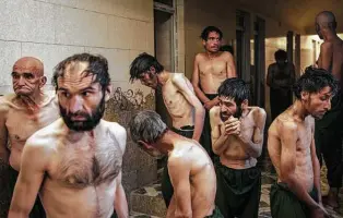  ?? ?? Detained drug users wait to be shaved after arriving at Avicenna Medical Hospital, where about 700 patients undergo withdrawal as part of a 45-day treatment program.