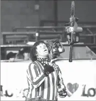  ?? Courtesy photo ?? Dr. Ronny Collins, a retired school superinten­dent, now living in Grandview, juggles chainsaws while dressed as a clown